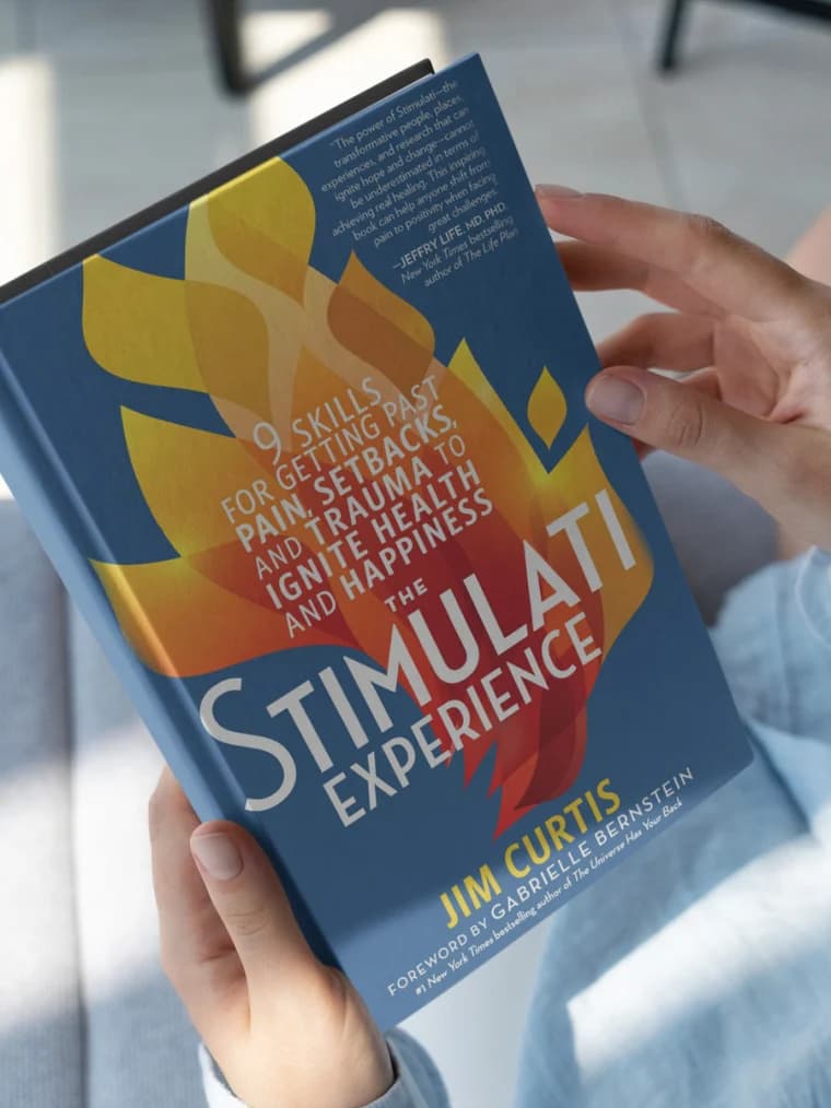The Stimulati Experience by Jim Curtis, held open in natural light
